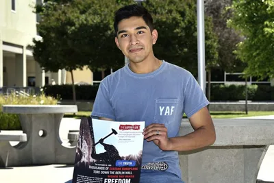 Student group sues college after president created 'excuse' to take down anti-communism posters