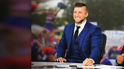 Tebow Auctions Heisman Trophy to Raise $1M for Kids in Need, Inspired by His Hero Parents