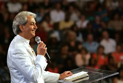 Court requires bank to seize assets from Benny Hinn Ministries after failure to pay marketing company