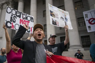 Battle Over Vaccine Mandates Heats Up Across the Nation