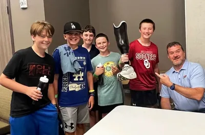 Fisher's prosthetic leg became a favorite sight at OKC Thunder games. For him, it's his faith coming full circle | Baptist Press