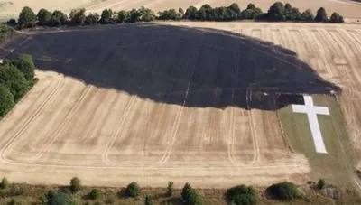 Lenham cross unscathed after field fire scorches ground during heatwave