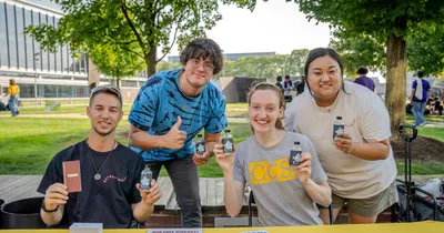 Michigan college ministry welcomes freshmen to campus by passing out holy water