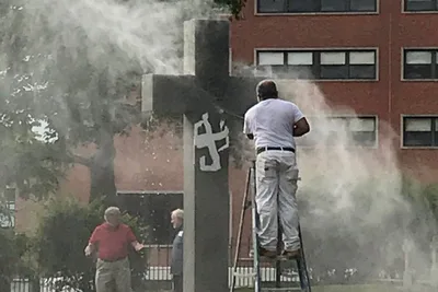 Cross and graves vandalized at Catholic university cemetery