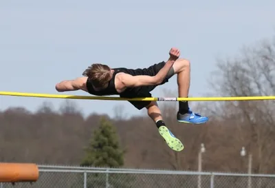 Male Athlete Takes First Place in Girls' High Jump Championship Meet