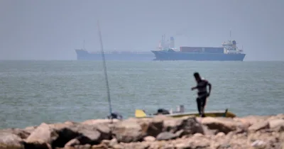 Evacuation paused in Strait of Hormuz after ship hit
