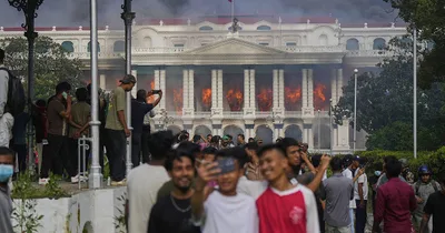 Nepal’s prime minister resigns as fiery protests continue