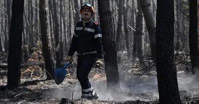 European wildfires rage on; Some French evacuee allowed home