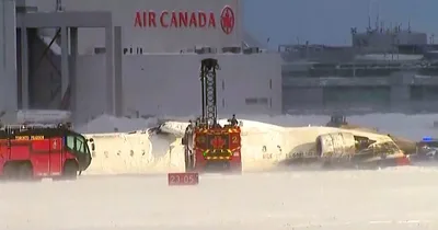 Delta plane flips on Canadian tarmac, eight injured